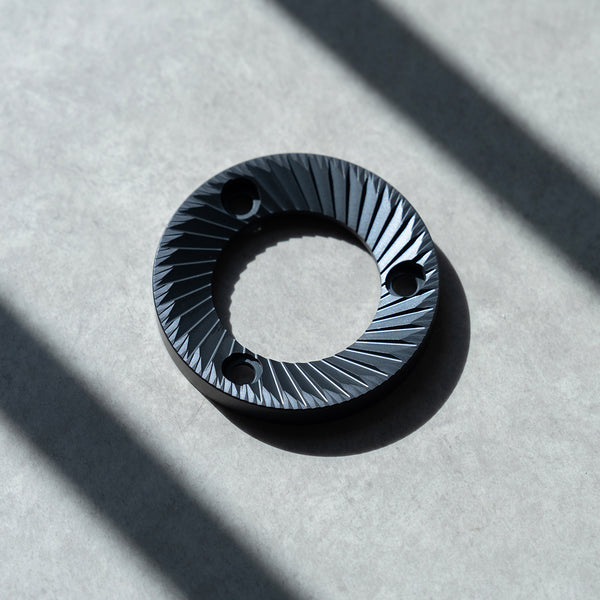 64mm flat burrs showcasing a detailed design for enhanced coffee grinding performance.