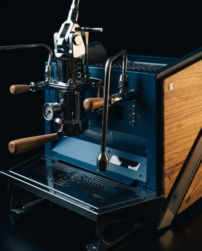 ACS Vostok One Group Espresso Machine with manual brew lever and wood accents on a sleek design.