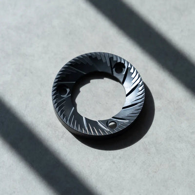 64mm flat burrs showcasing precision engineering and durable construction for optimal brewing performance.