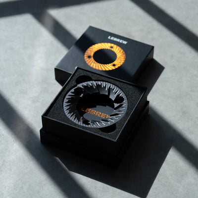 64mm flat burrs from LeBrew in elegant packaging, showcasing precision engineering for enhanced brewing.