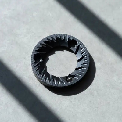 64mm flat burrs showcasing precision engineering for enhanced brewing experience.