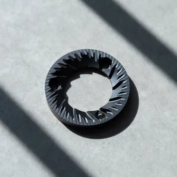 64mm flat burrs showcasing precision engineering for enhanced brewing experience.